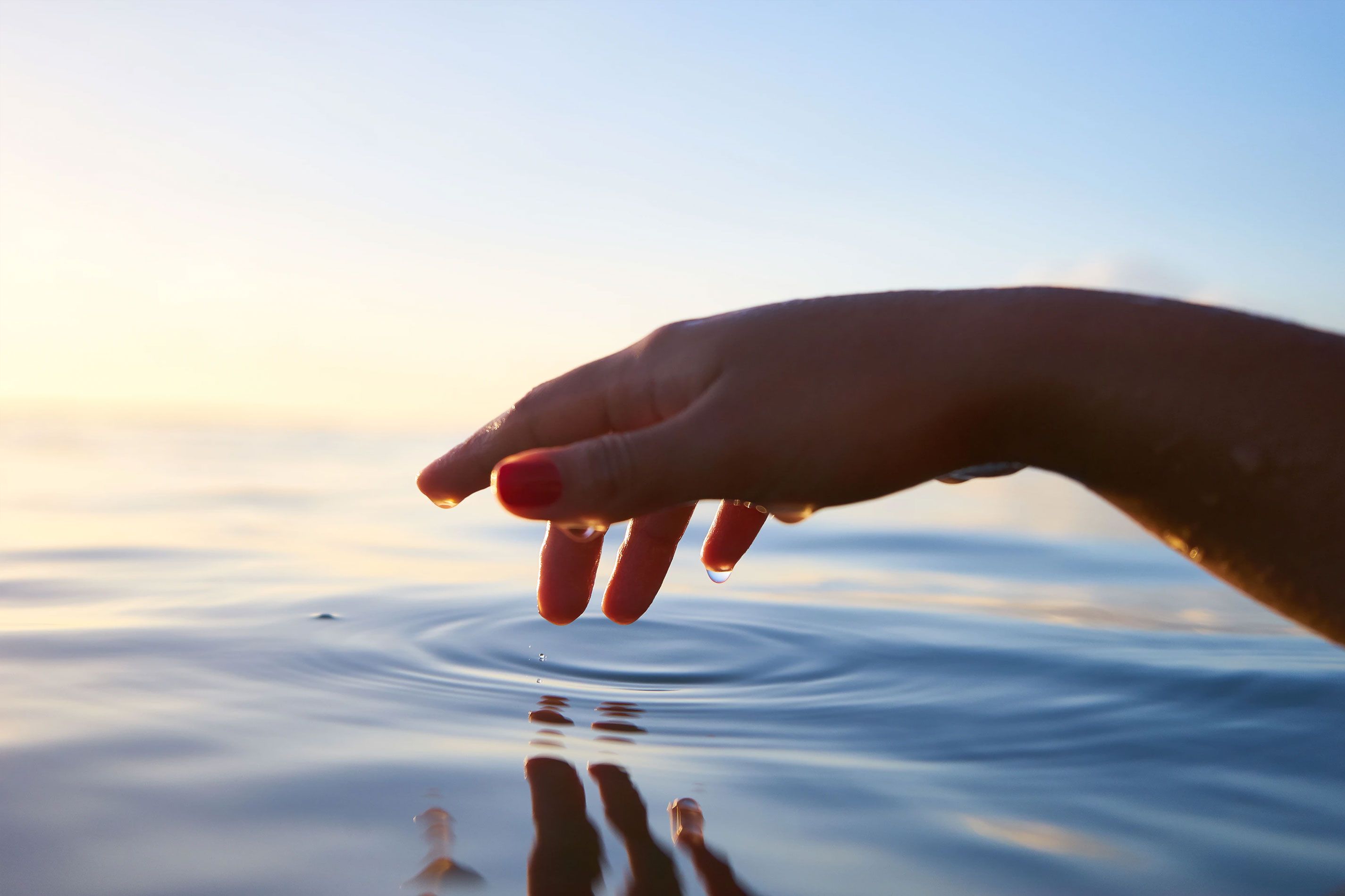 Hand Touching Water